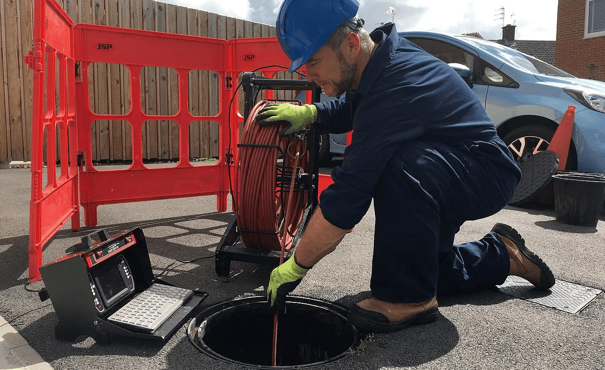 Manc Rod Employee Inspecting drain with camera system